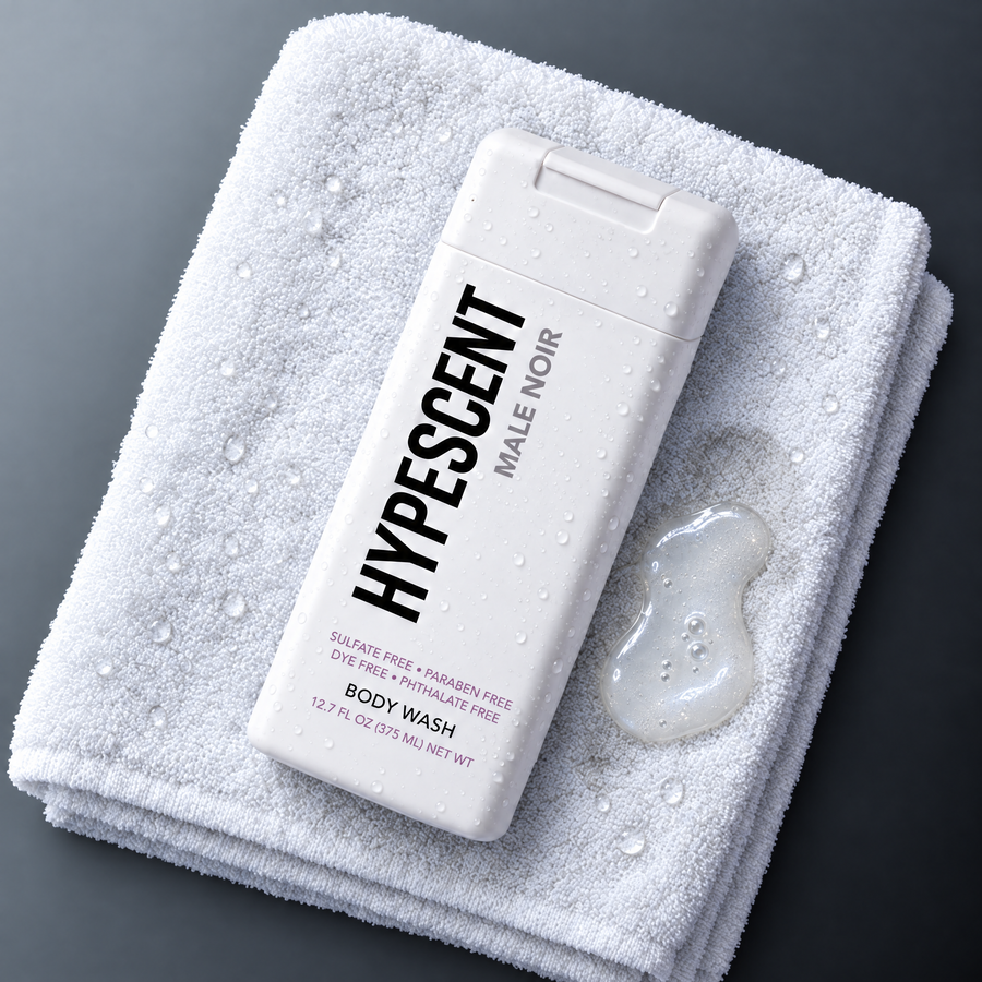 HYPESCENT Male Noir body wash bottle on a white towel next to a drop of clear gel
