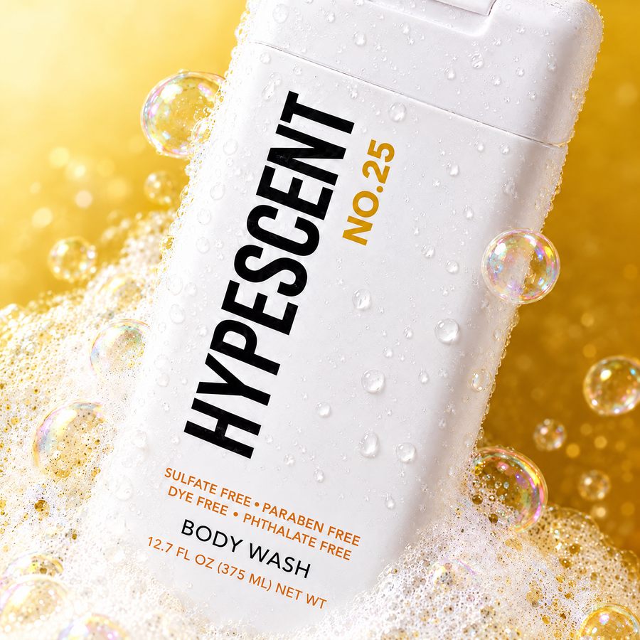 Close-up of the HYPESCENT No. 25 body wash label with rich foam and bubbles