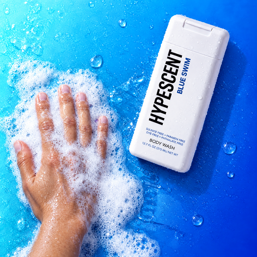 Hand lathering HYPESCENT Blue Swim body wash into a rich foam