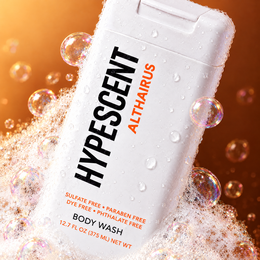 Close-up of the HYPESCENT Althaïrus body wash label with rich foam and bubbles