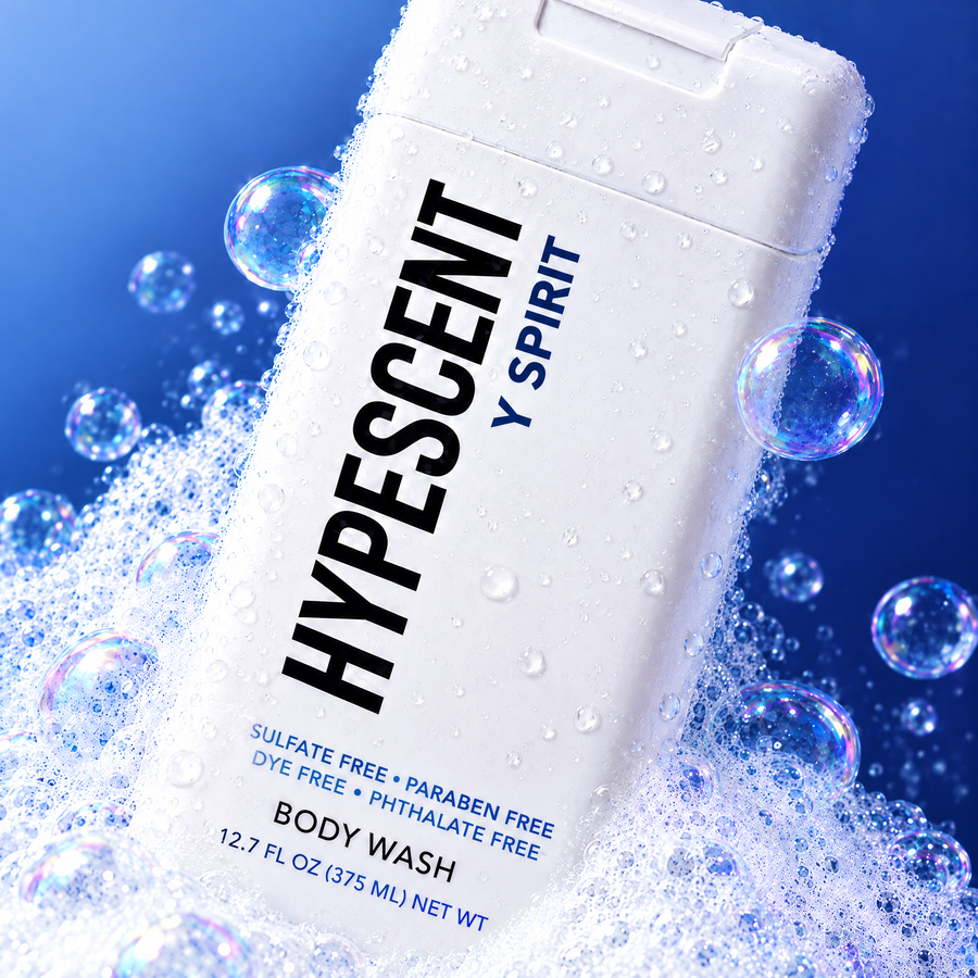Close-up of the HYPESCENT Y Spirit body wash label with rich foam and bubbles