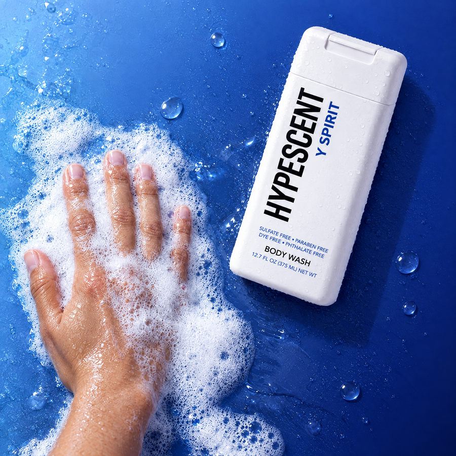 Hand lathering HYPESCENT Y Spirit body wash into a rich foam